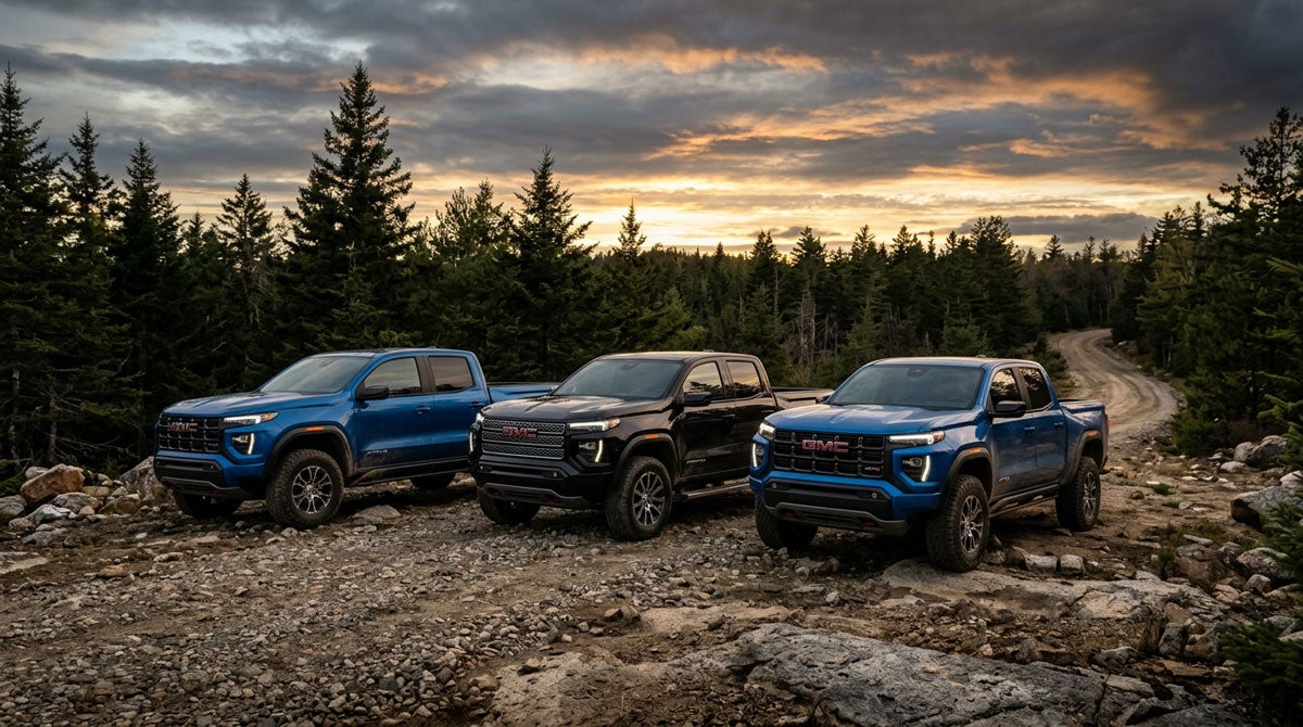2026 GMC Canyon lineup on a Southern Maine dirt road at golden hour