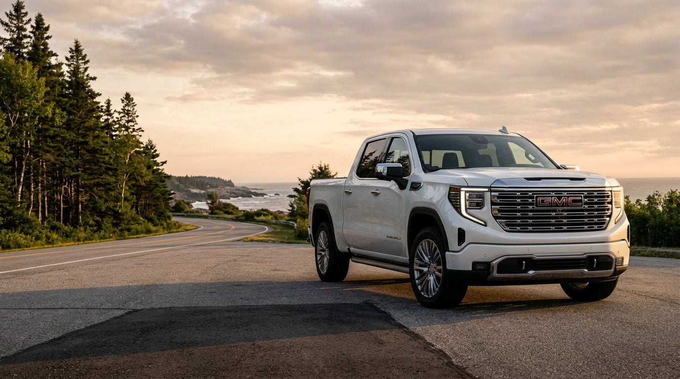 2026 GMC Sierra 1500 on a Southern Maine road at golden hour